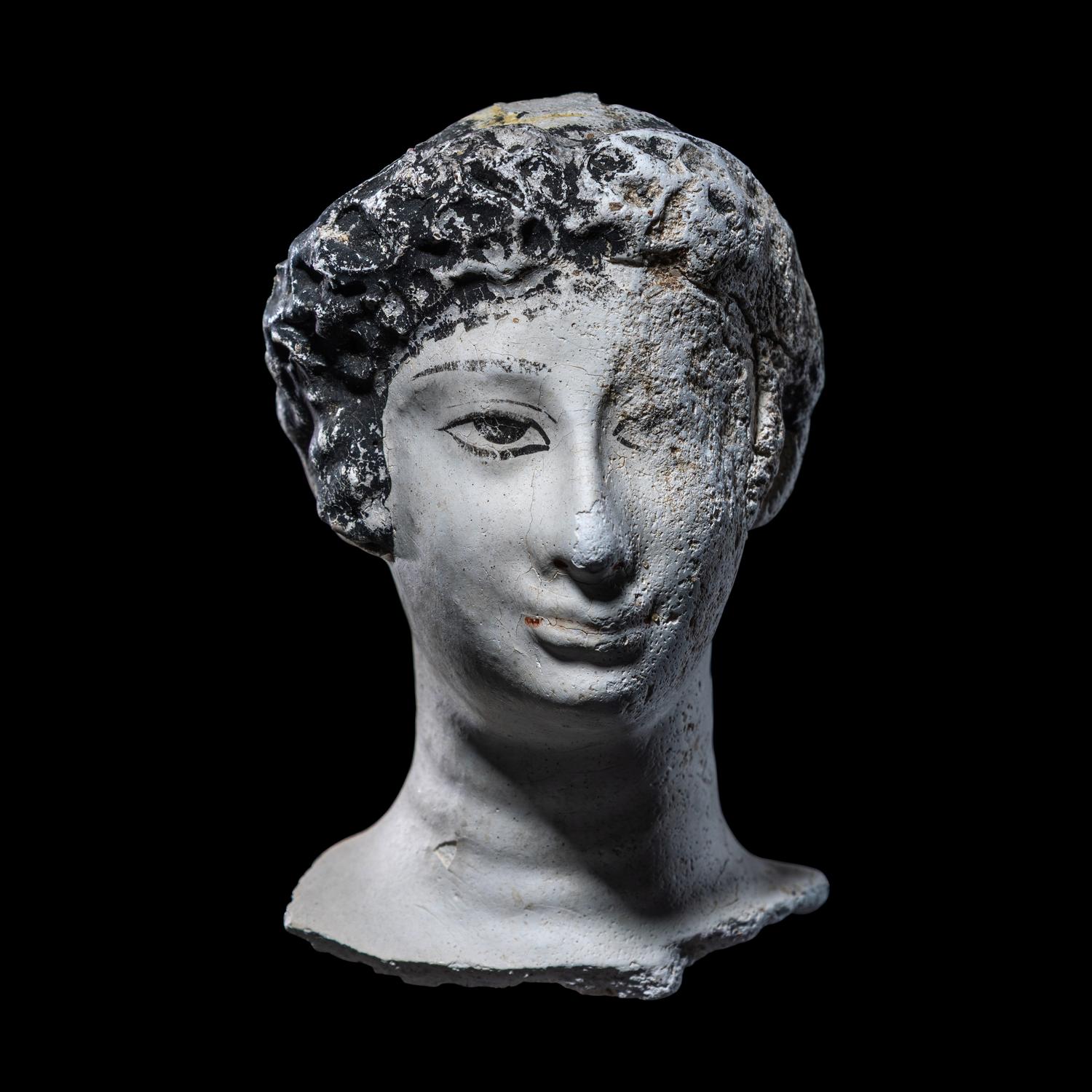 An Egyptian Painted Stucco Mummy Mask