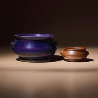 Two Chinese Monochrome Glazed Porcelain Censers, 17th-18th Century — 清早中期 紫金釉及藍釉獅耳爐兩具
