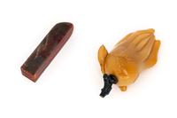 A Chinese Bloodstone Seal and A Yellow Hardstone Snuff Bottle