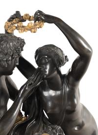 A French Parcel Gilt and Patinated Bronze Figural Mantel Clock