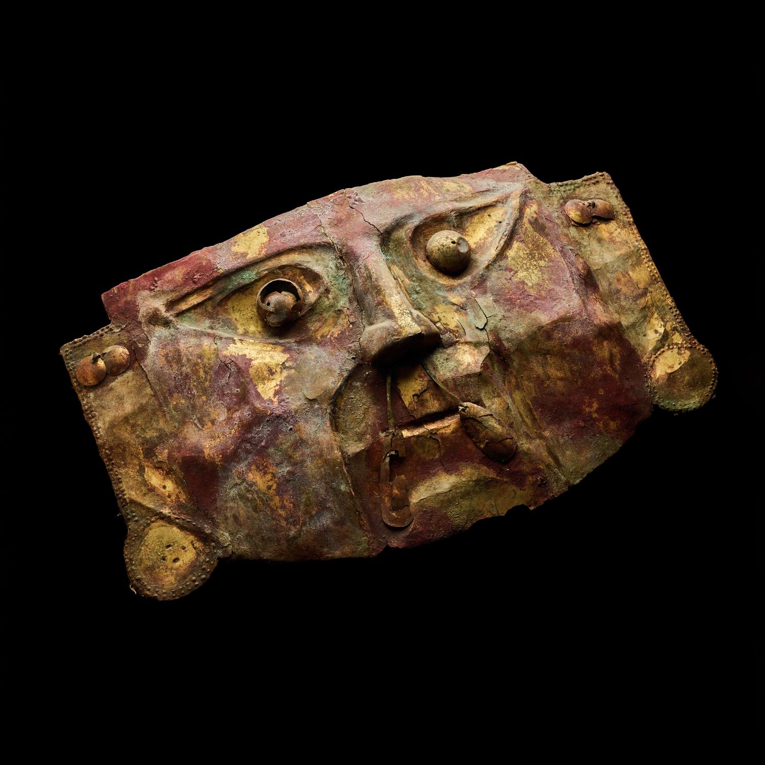 A Chimu Metal Mask with Red Pigment