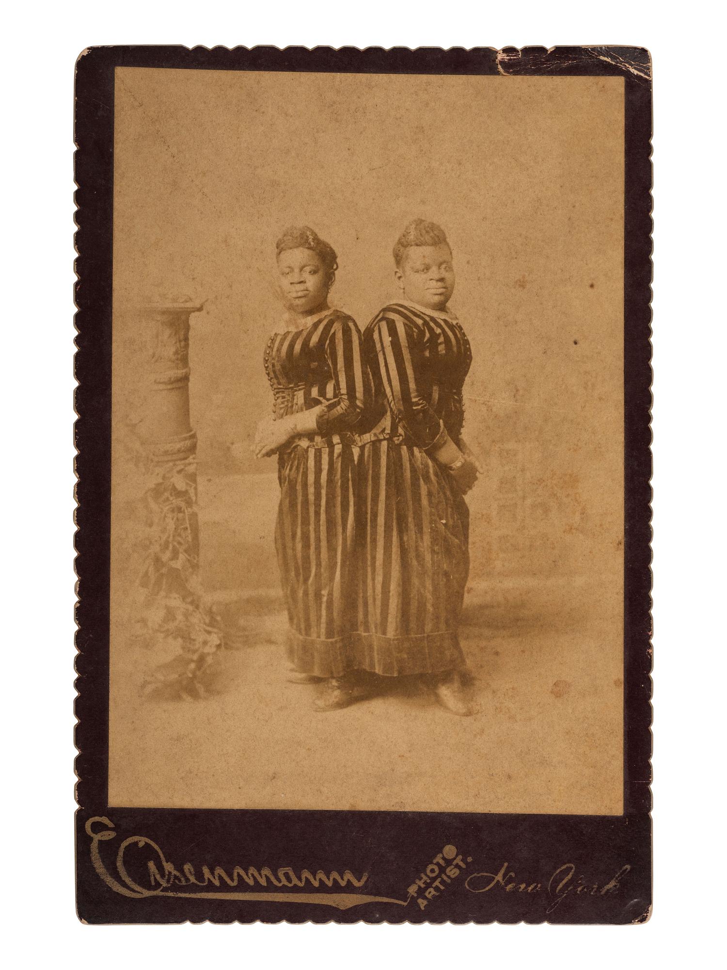[AFRICAN AMERICANA]. MCKOY, Millie and Christine. Autographed cabinet card of the famous conjoined twins from North Carolina. New York: Eisenmann, ca 1890s.