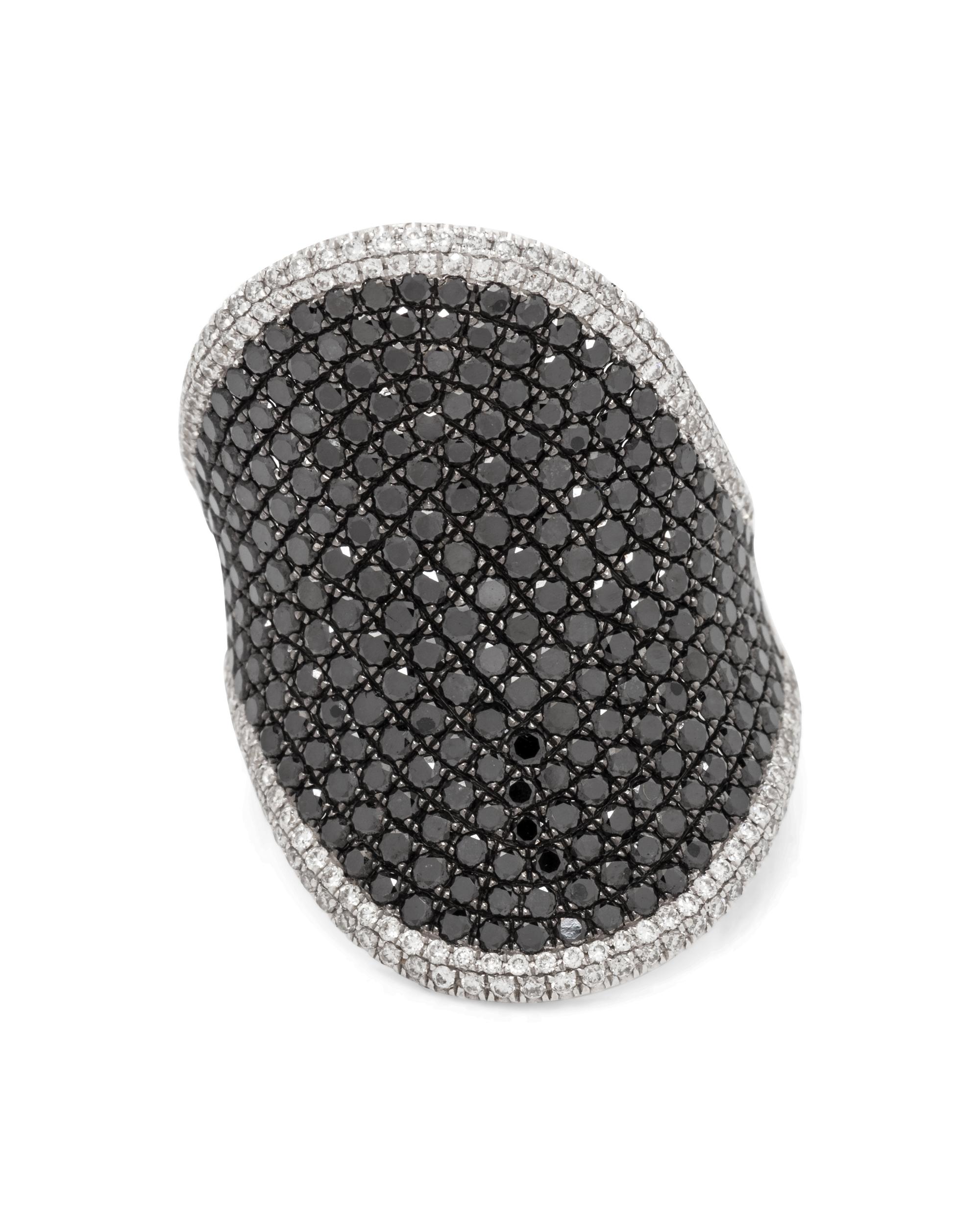 An 18 Karat White Gold, Black Diamond and Diamond Ring,