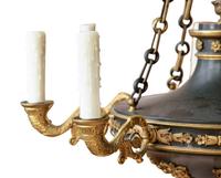 An Empire Style Patinated and Gilt Bronze Eight-Light Chandelier