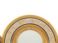 A Set of Twelve Hutschenreuther Gilt Decorated White and Cobalt GLazed Porcelain Dinner Plates