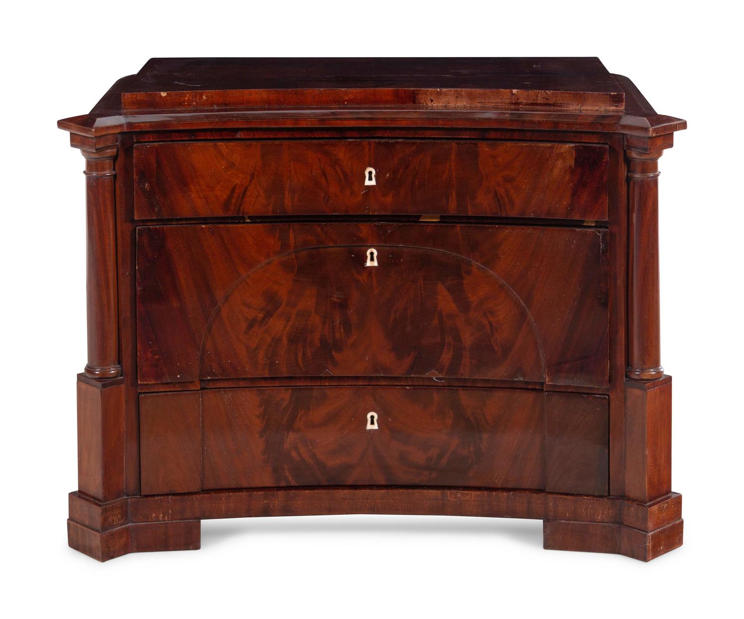 A German Mahogany Concave-Front Chest of Drawers