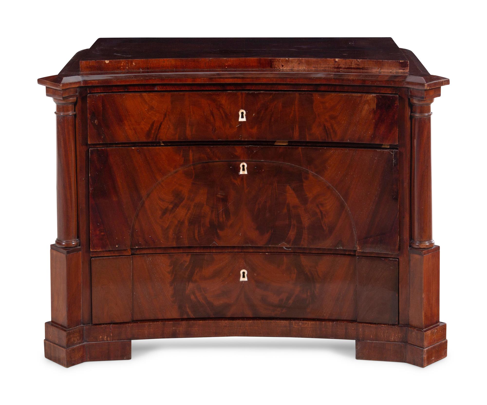 A German Mahogany Concave-Front Chest of Drawers