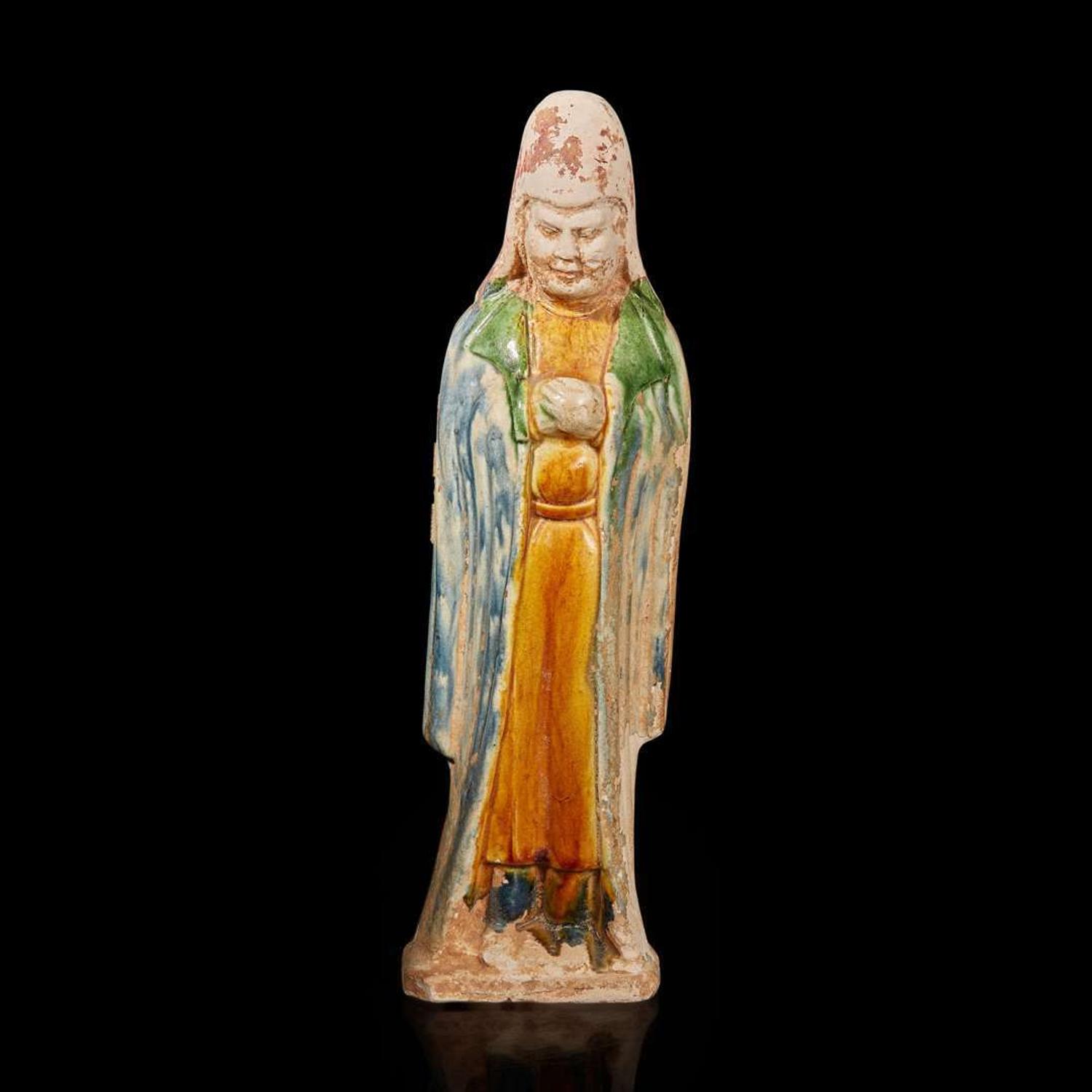 A Chinese sancai-glazed pottery attendant 三彩人物 Probably Tang dynasty ??