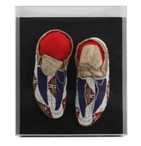 A Pair of Sioux Mocassins Length 11 inches. — CIRCA 1900