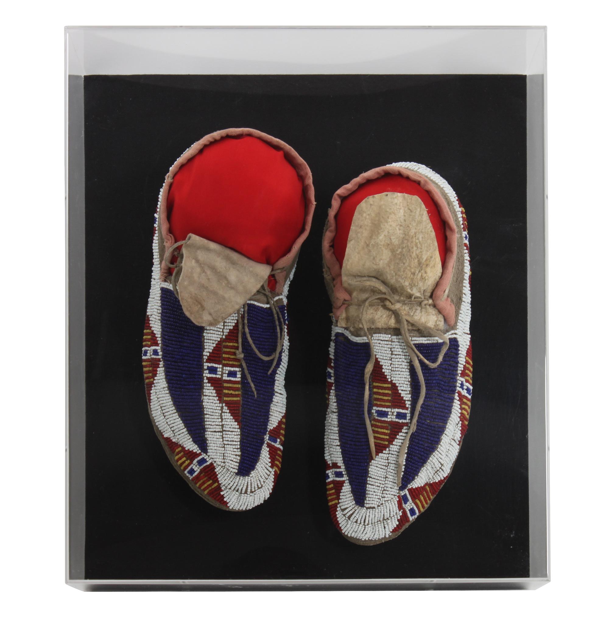 A Pair of Sioux Mocassins Length 11 inches. — CIRCA 1900