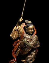 A Gilt and Lacquered Wood Figure of a Guardian
