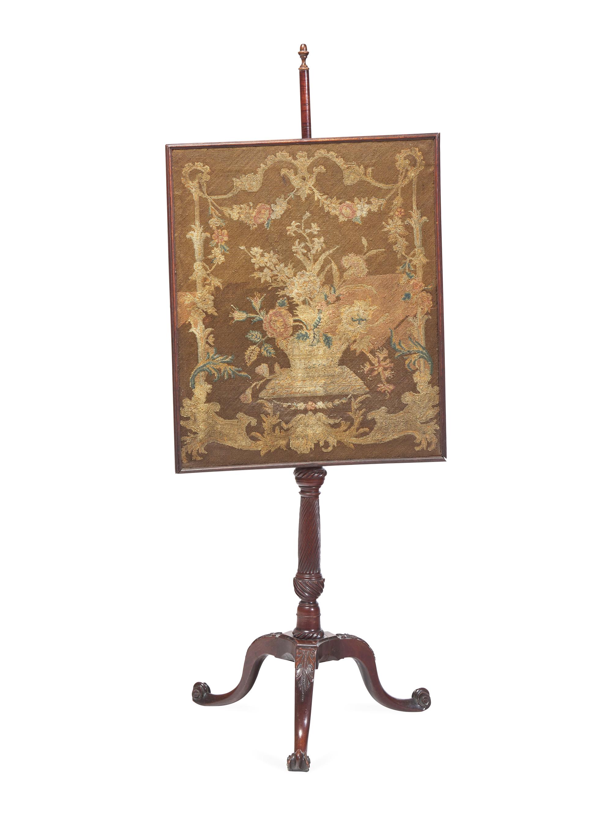 A George III Carved Mahogany Fire Screen With Petit Point Needlework Panel