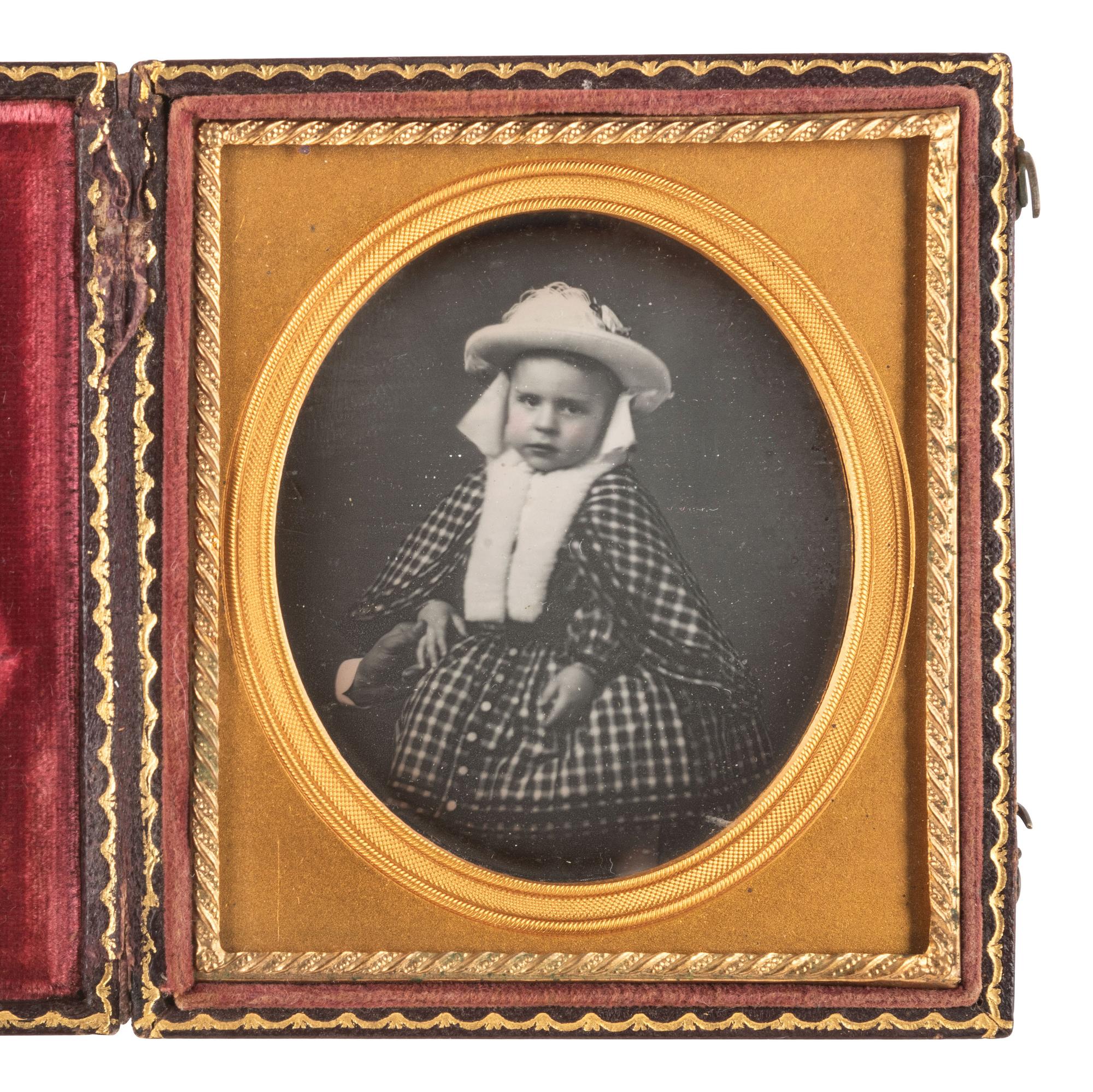 [AFRICAN AMERICANA - EARLY PHOTOGRAPHY]. Sixth plate daguerreotype portrait of a nicely-dressed child, with the hand of an African American subject visibly grasping the child's hand.