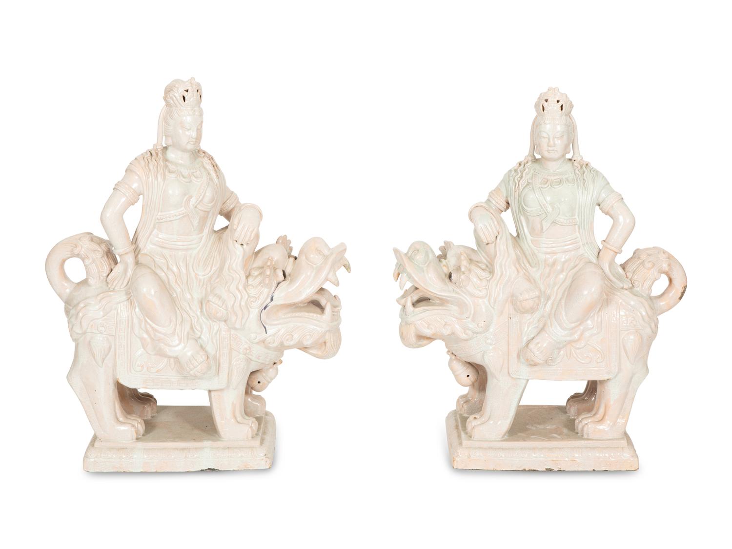 A Pair of Chinese Glazed Ceramic Figures of Guan Yin Atop a Foo Dog