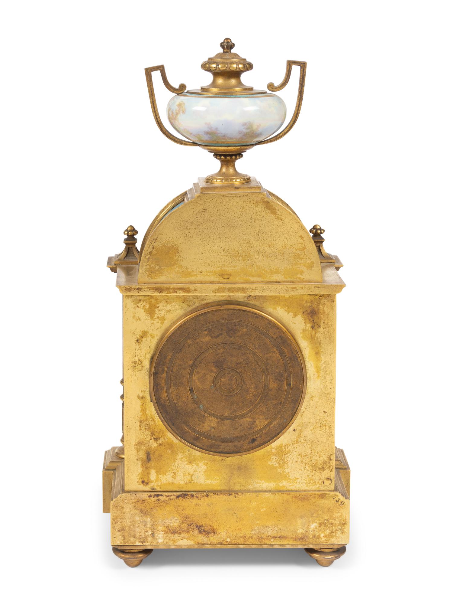 A Louis XVI Style Porcelain Mounted Gilt Bronze Mantel Clock