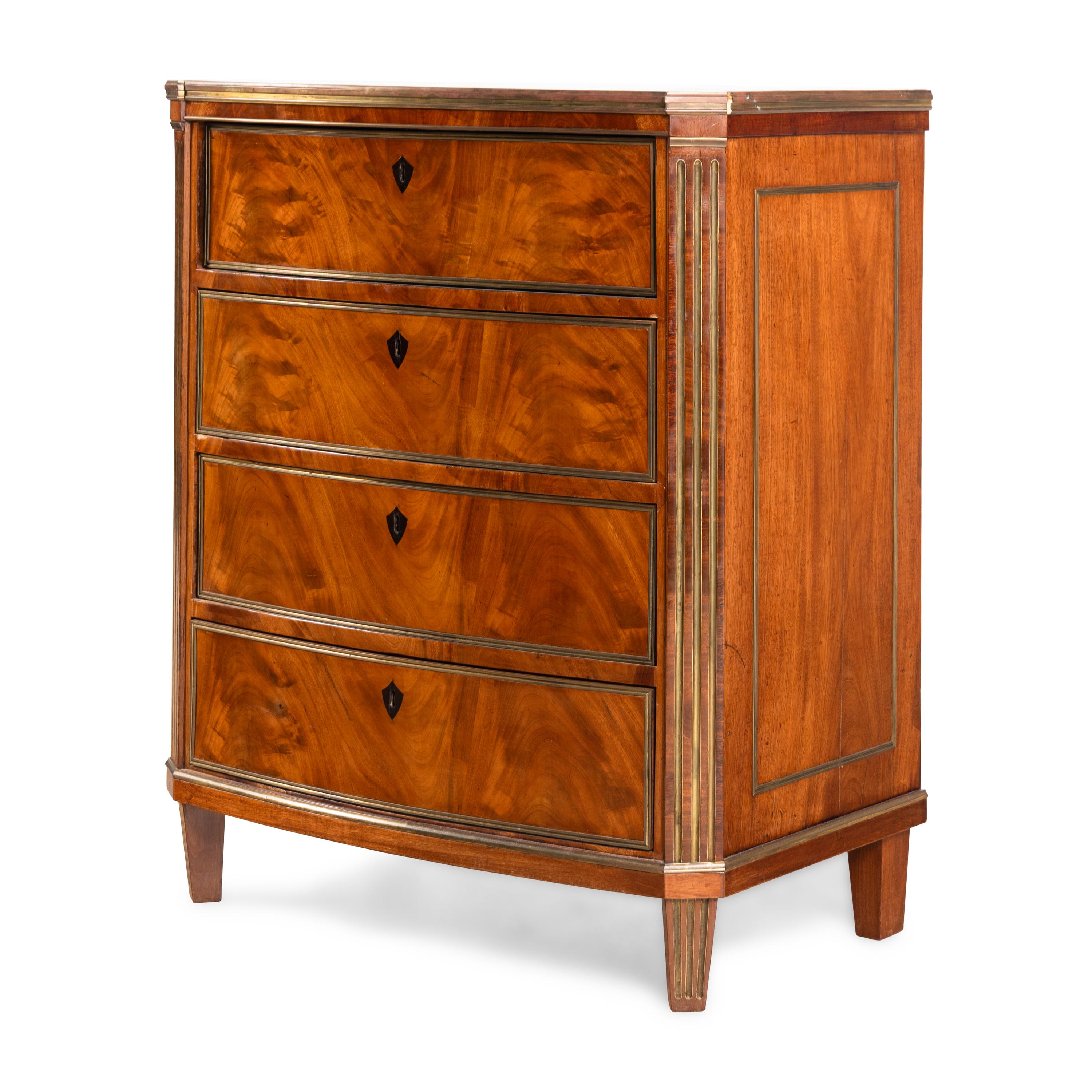 A Russian or Baltic Neoclassical Brass Mounted Mahogany Chest of Drawers