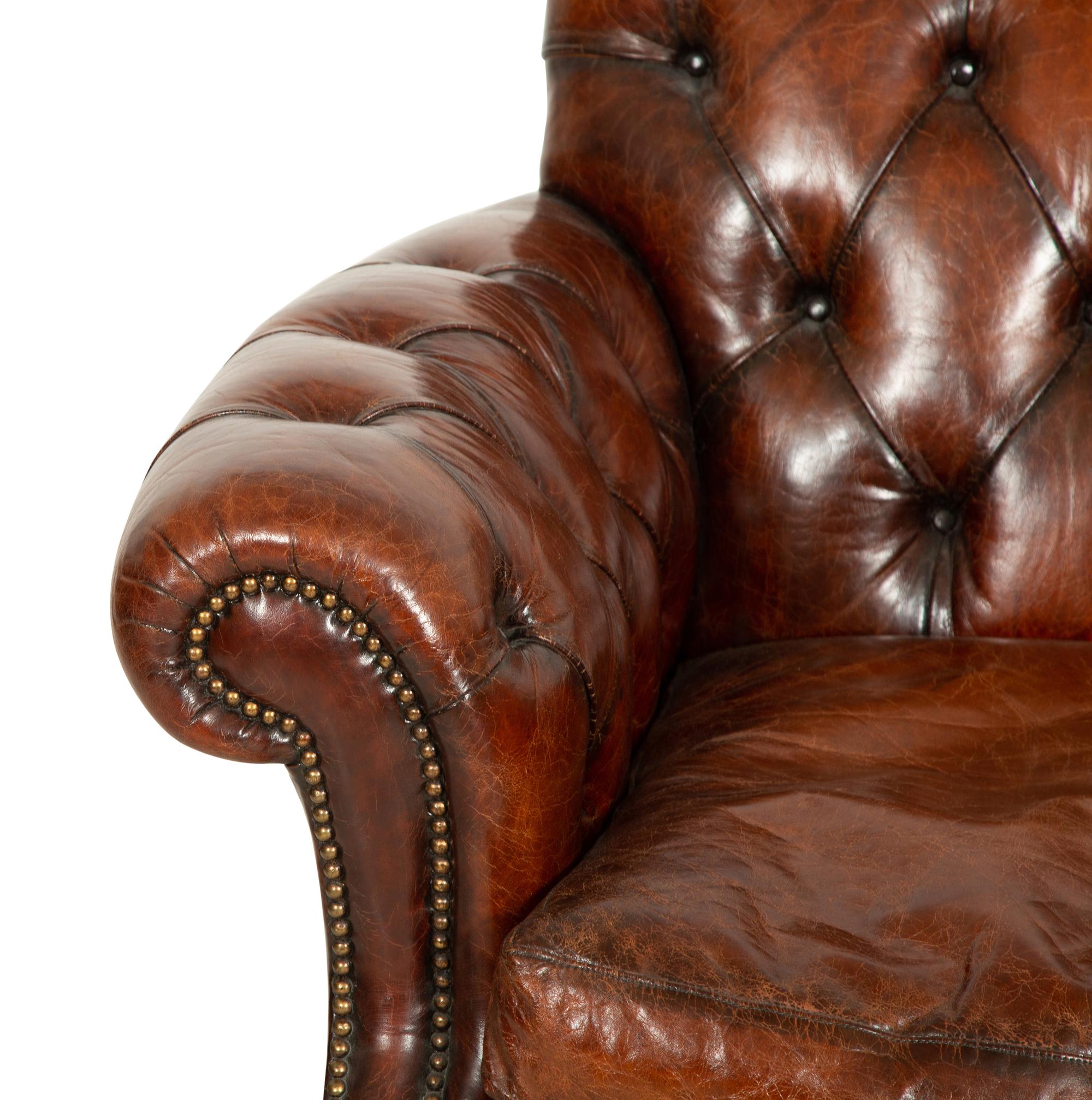 A Pair of Chesterfield Style Leather Club Chairs