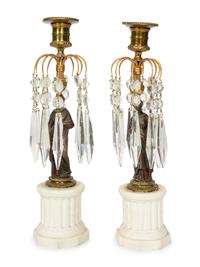 A Pair of French Patinated Bronze and Biscuit Porcelain Candlesticks