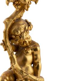 A Pair of French Gilt Bronze and Bourdin Porcelain Figural Candlesticks