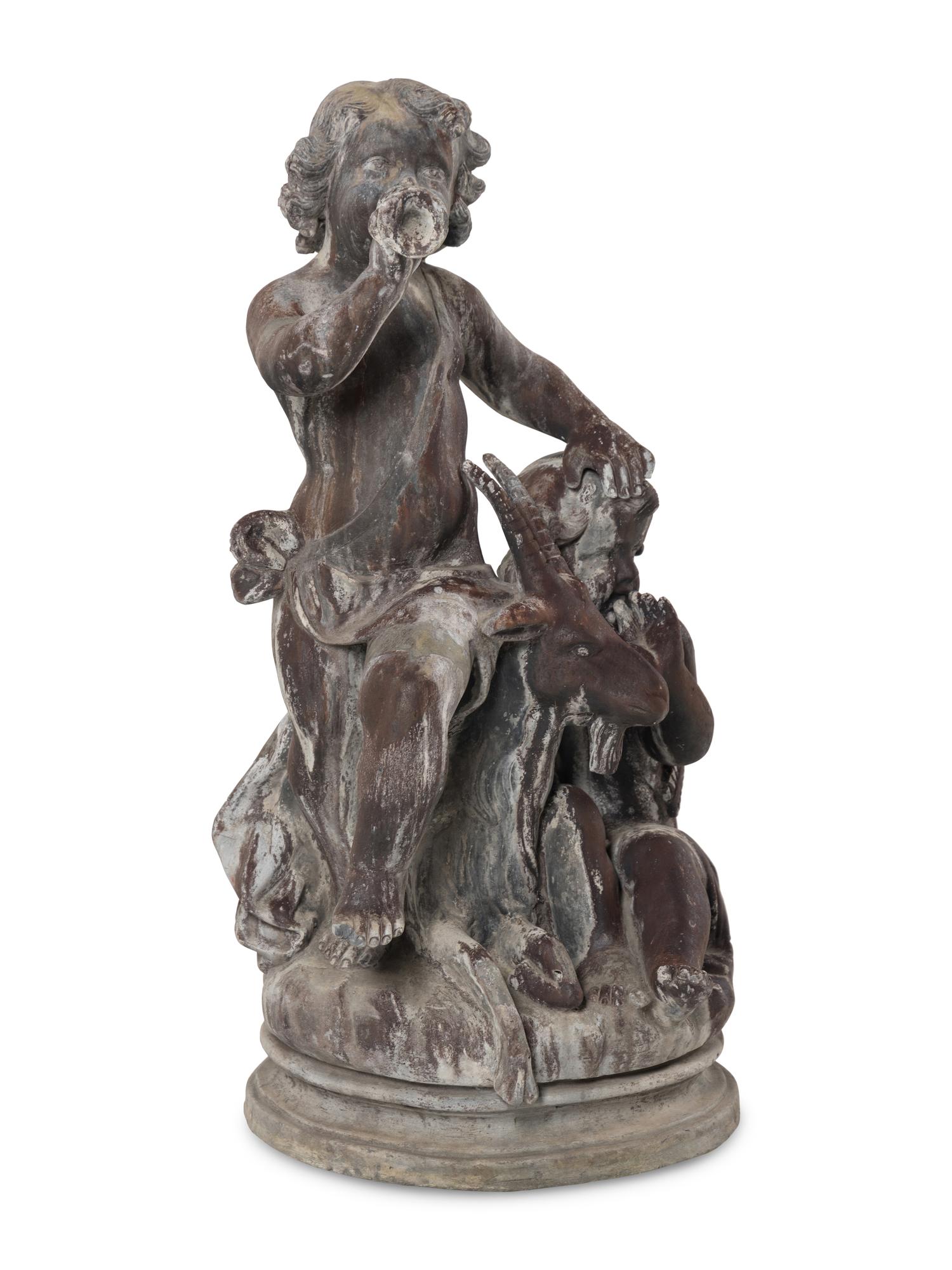 A Cast Lead Figural Group