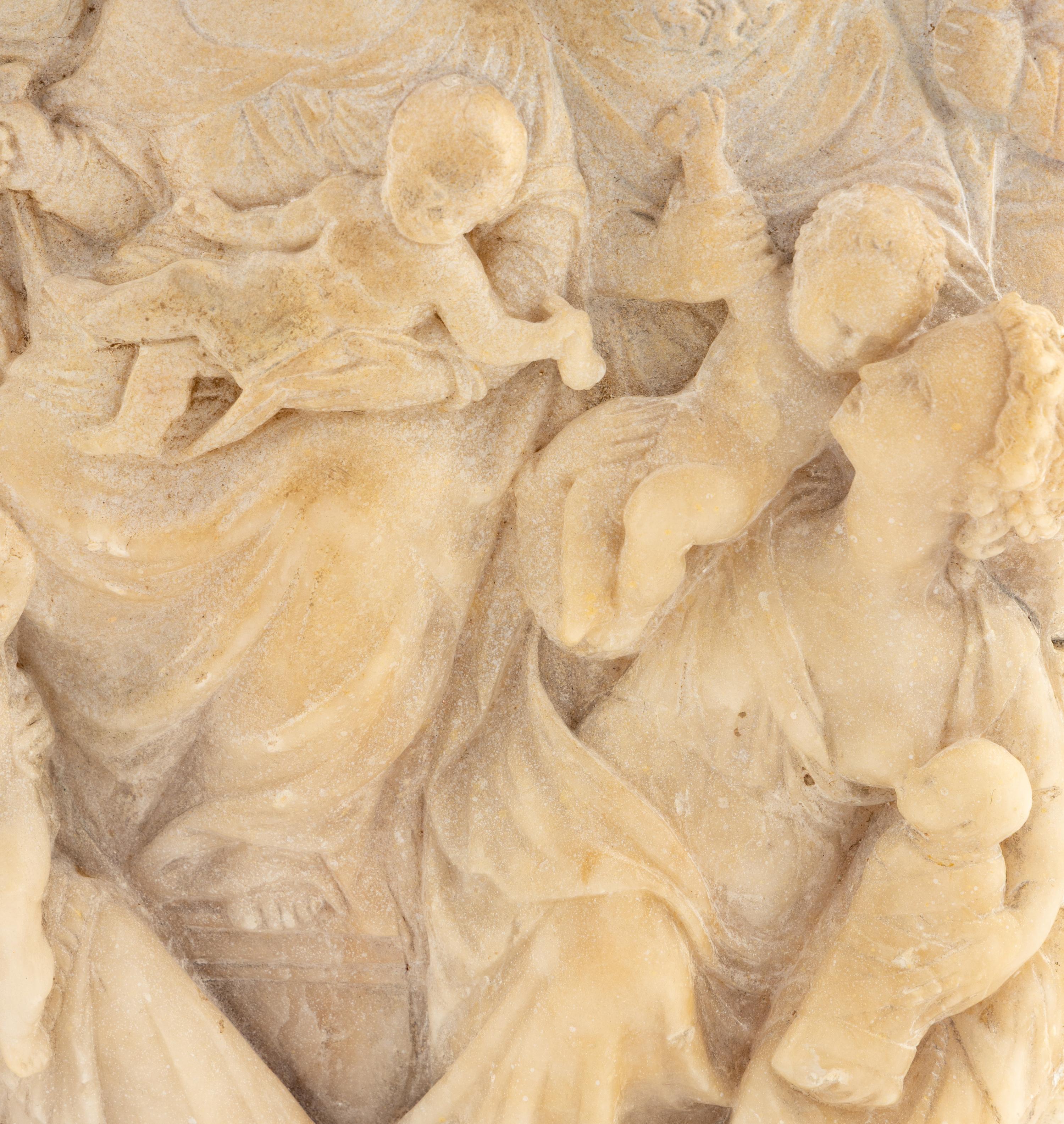 A Continental Carved Marble Relief Plaque
