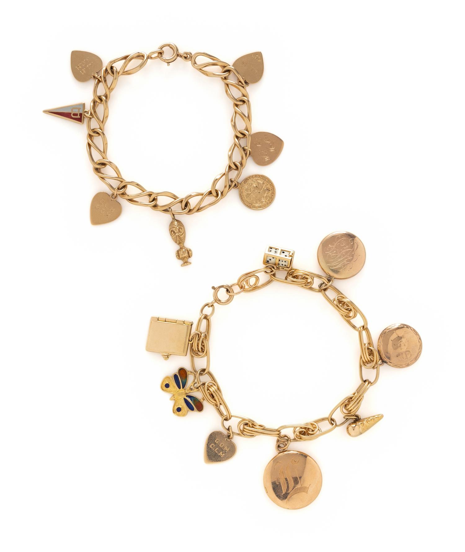 COLLECTION OF YELLOW GOLD CHARM BRACELETS