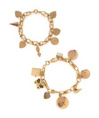 COLLECTION OF YELLOW GOLD CHARM BRACELETS