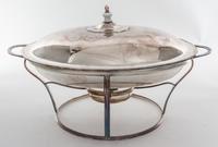 A Sheffield-plate Entree Dish and Cover, Early 19th Century, of two handled oval form, set on a warming stand with a spirit lamp.