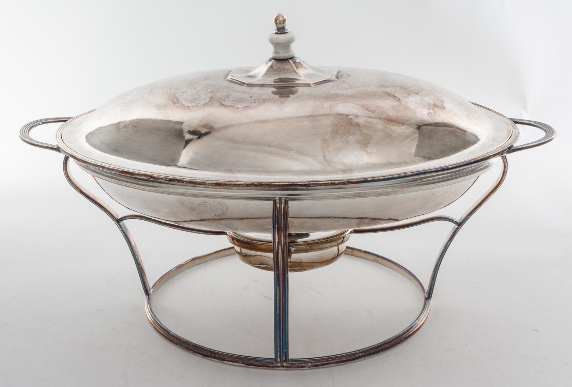 A Sheffield-plate Entree Dish and Cover, Early 19th Century, of two handled oval form, set on a warming stand with a spirit lamp.