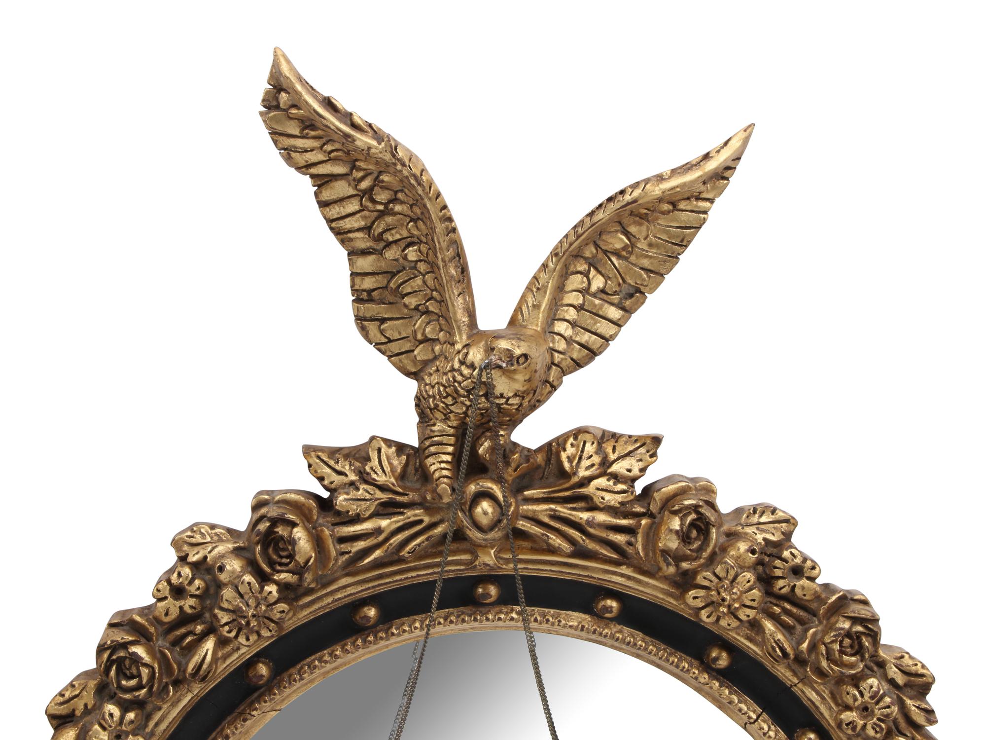 A Pair of Regency Style Ebonized and Parcel-Gilt Mirrors