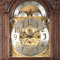 A Renaissance Revival Carved Oak Tall Case Clock