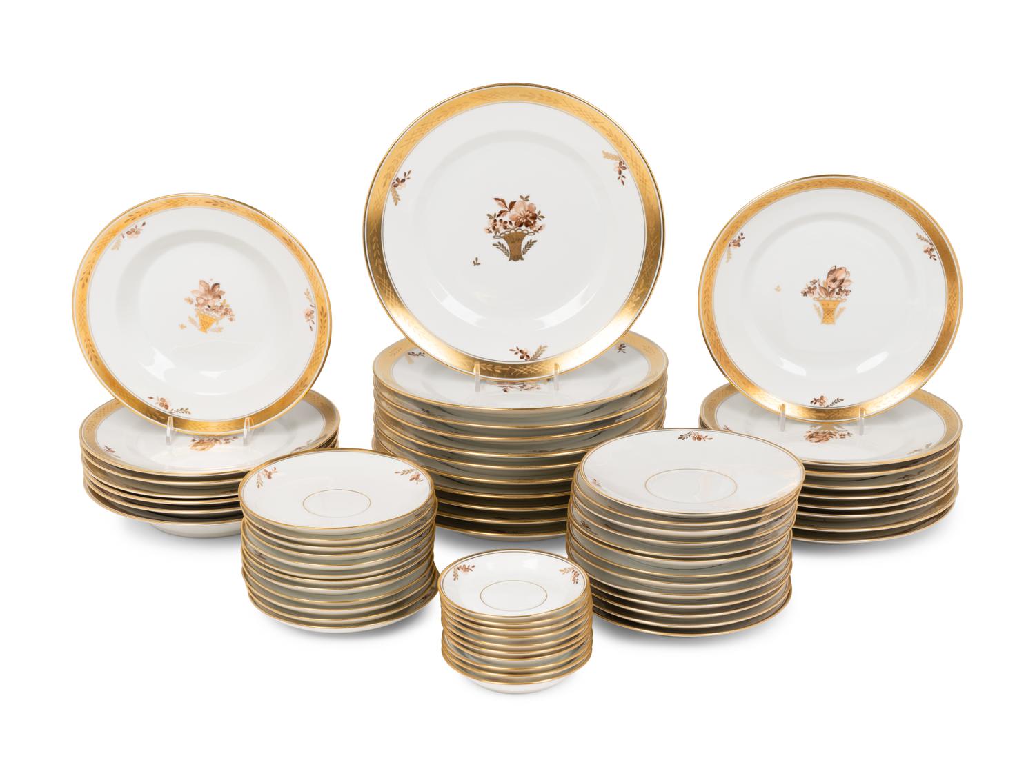 A Royal Copenhagen Golden Basket Porcelain Dinner Service