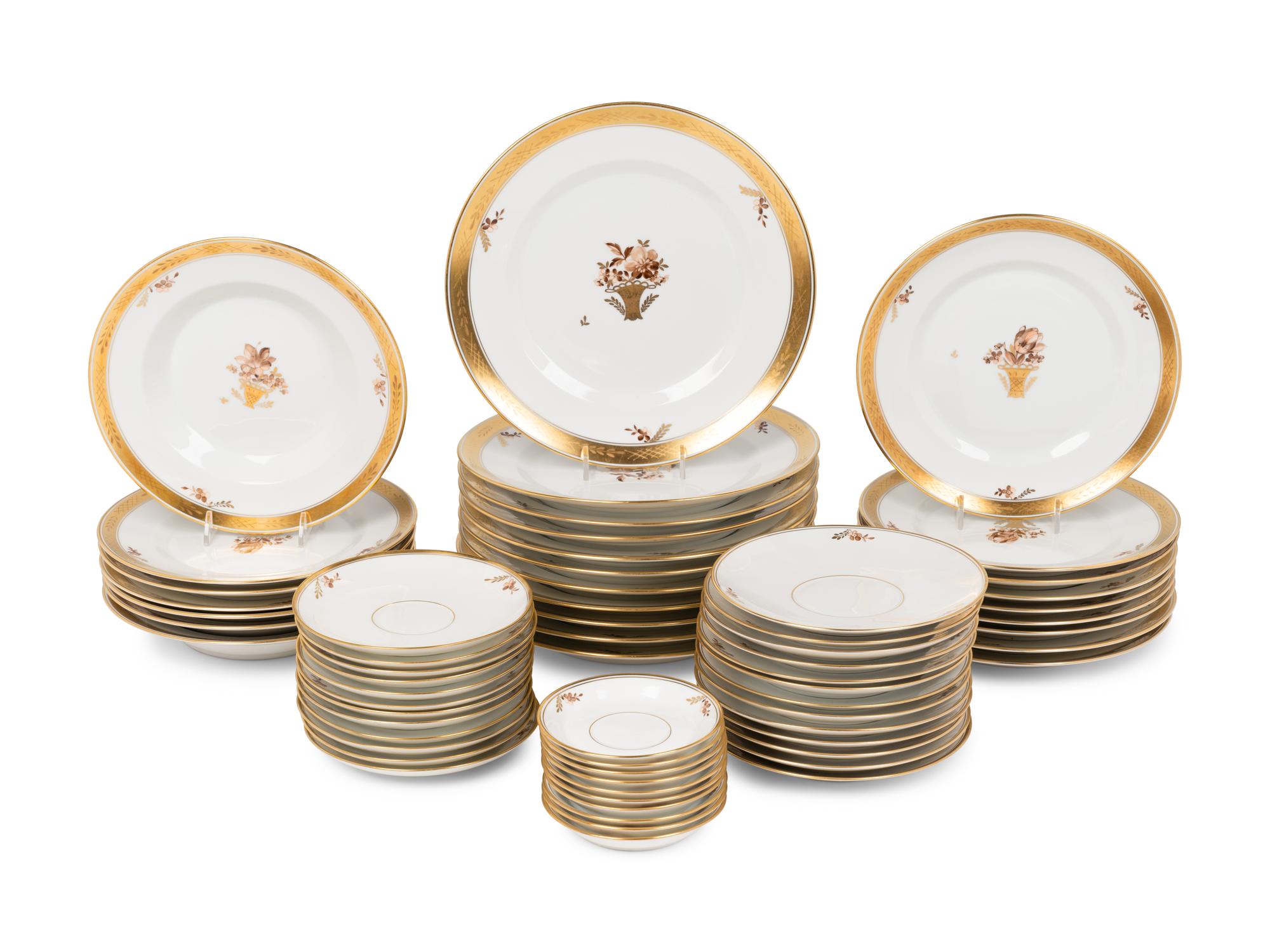 A Royal Copenhagen Golden Basket Porcelain Dinner Service