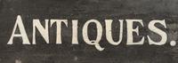 A Painted Wood Antiques Seller's Trade Sign