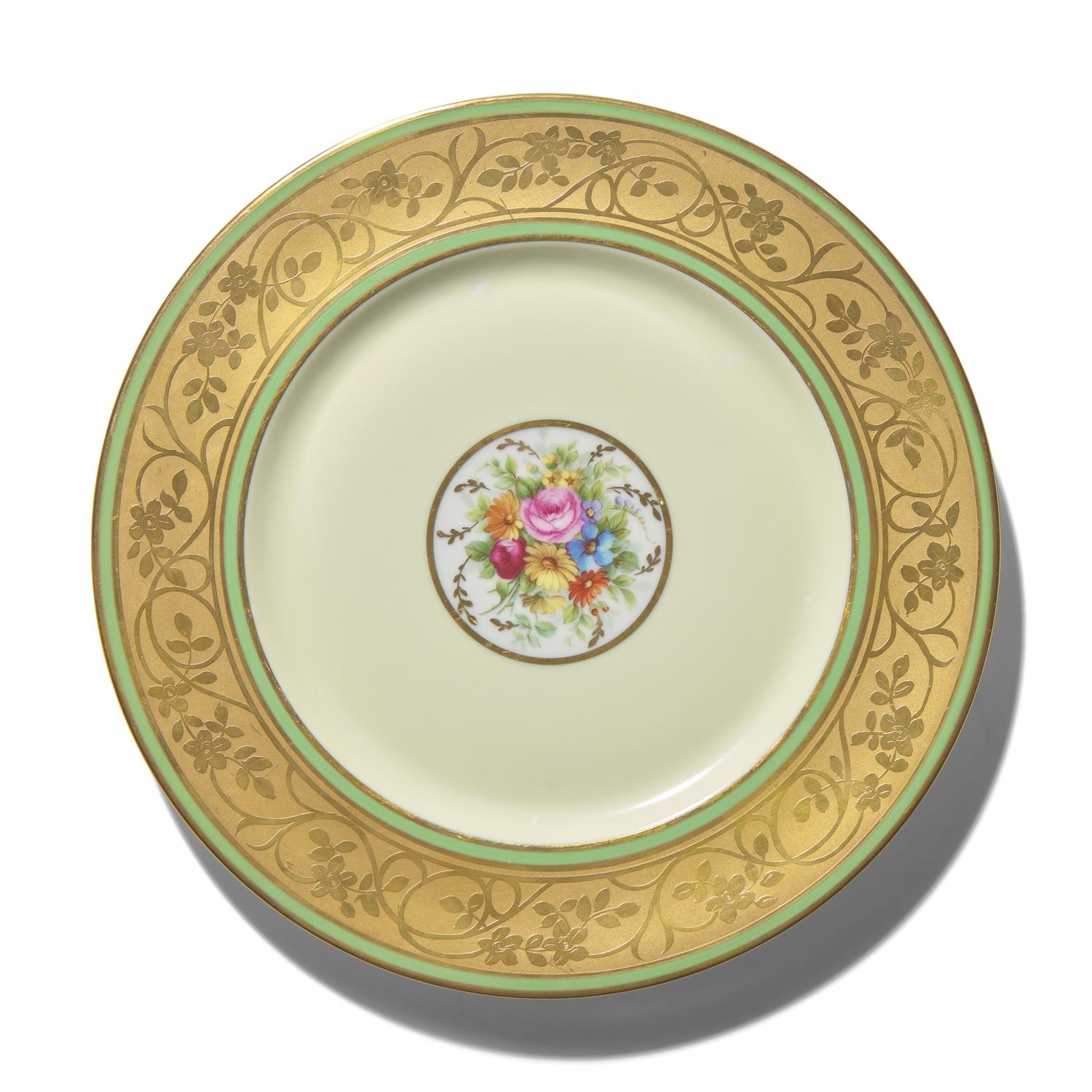 A Set of Twelve Limoges Porcelain Chargers