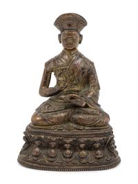 A Tibetan Bronze Figure of a Lama