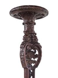 A Pair of Louis XIV Style Carved Oak Torchères
