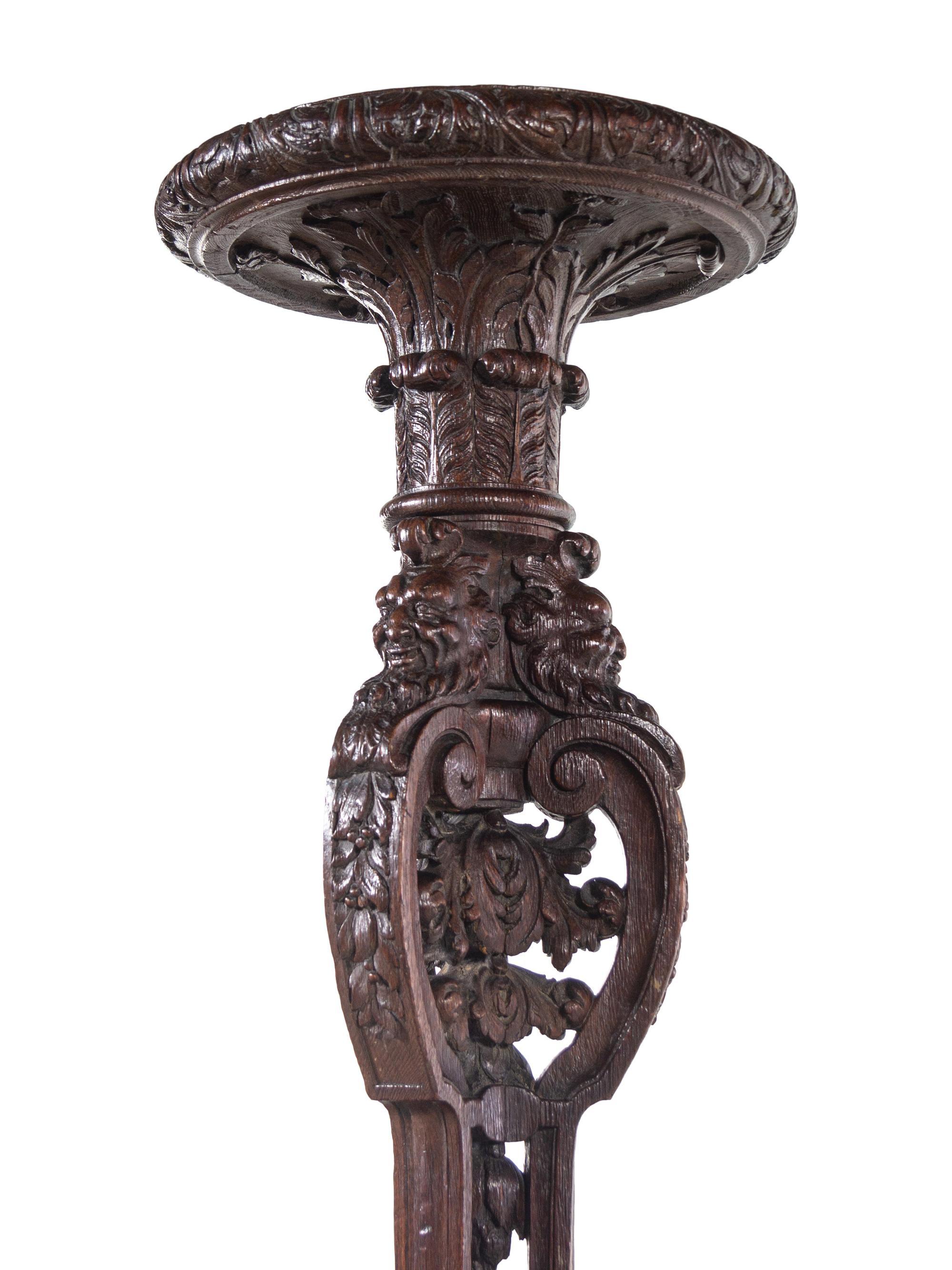A Pair of Louis XIV Style Carved Oak Torchères
