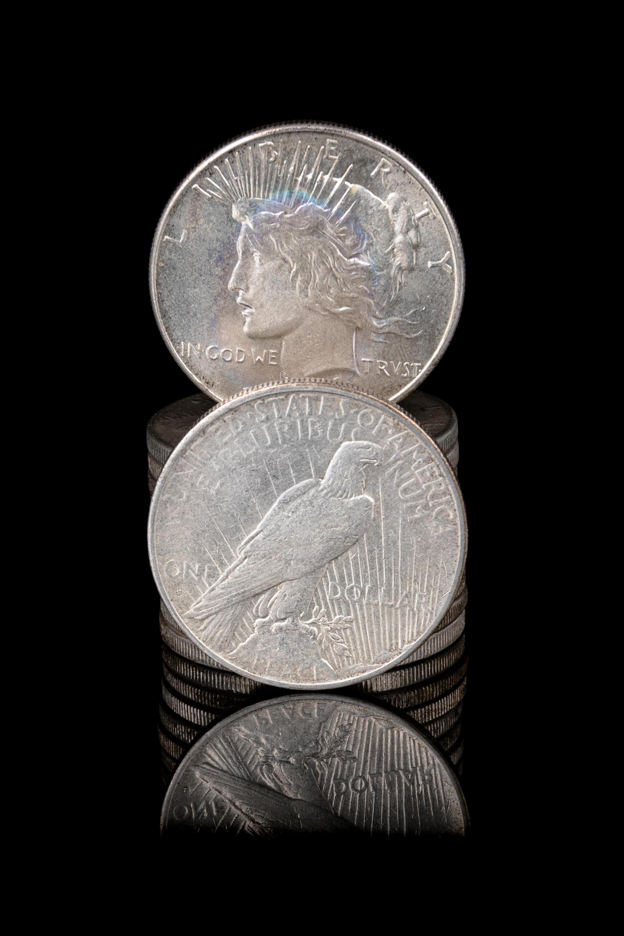 A Group of Twelve Peace $1 Coins