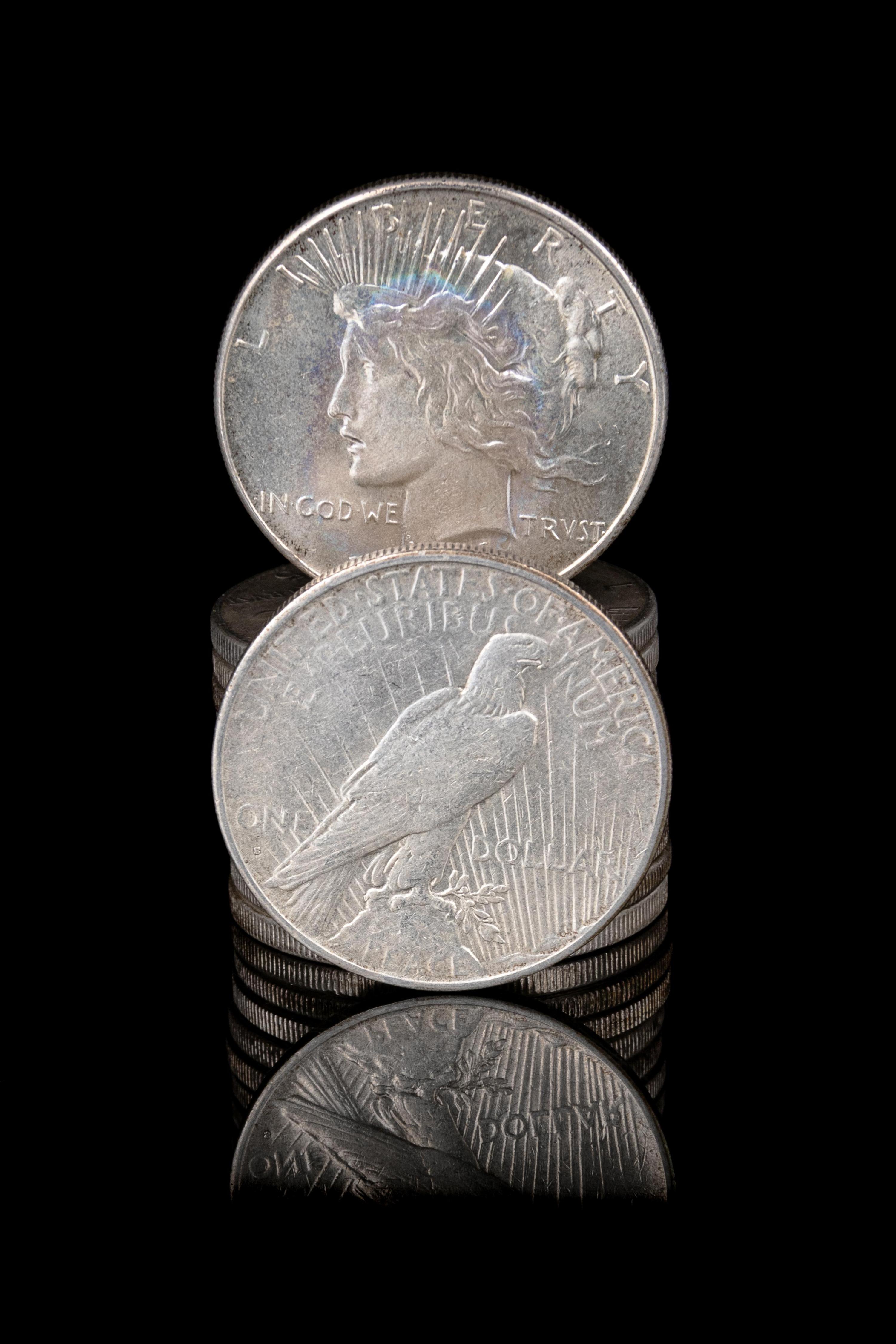 A Group of Twelve Peace $1 Coins