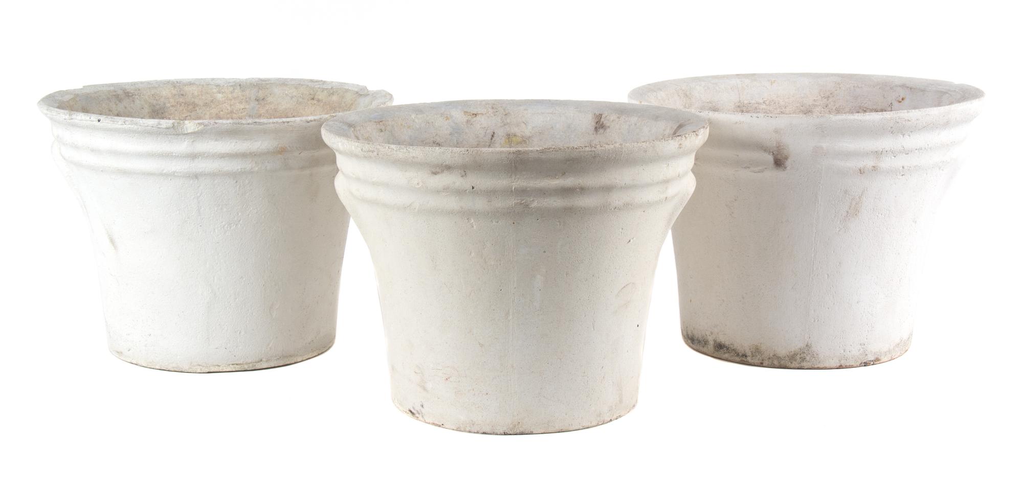 A Group of Five Concrete Planters Height of largest 17 inches x diameter 13 1/2 inches.