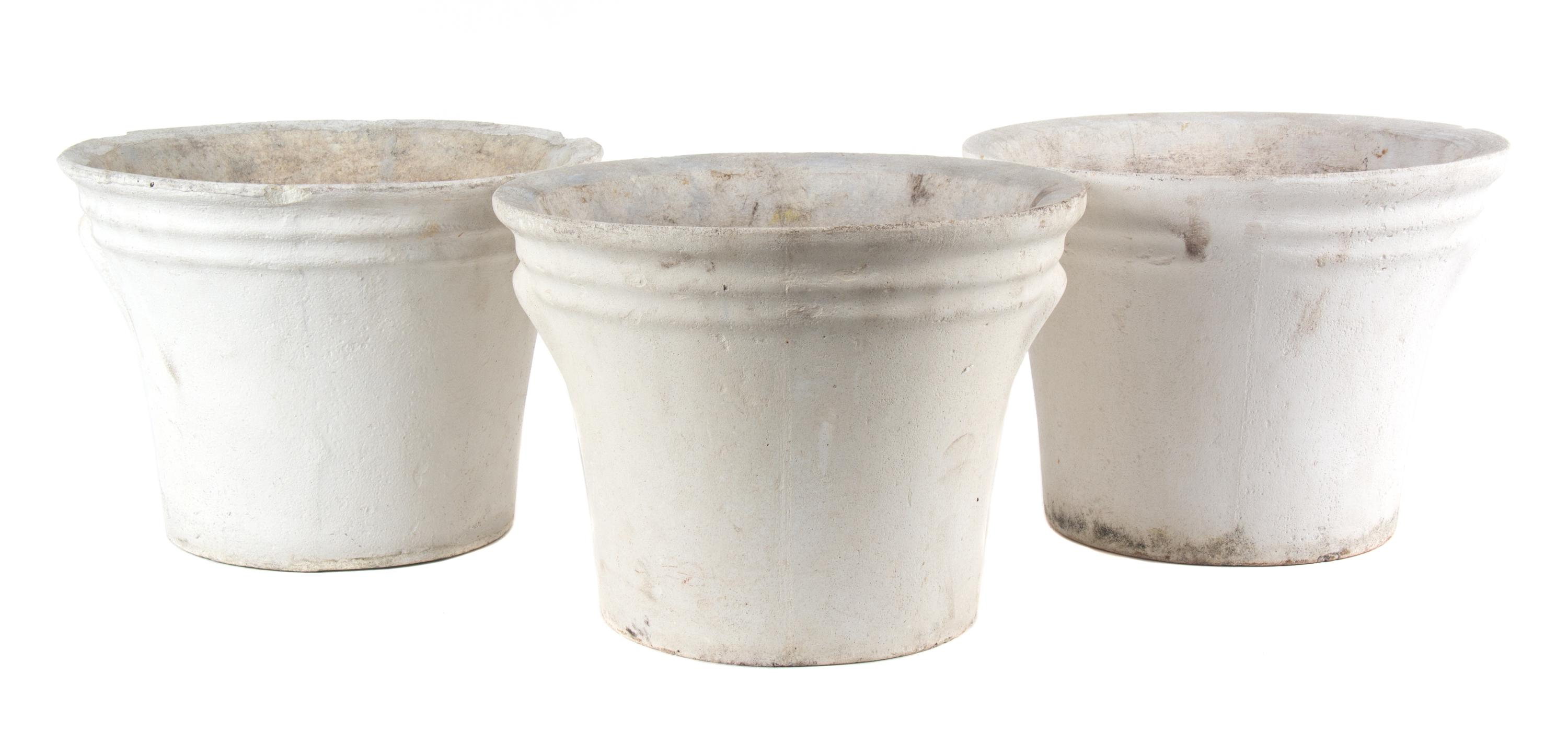 A Group of Five Concrete Planters Height of largest 17 inches x diameter 13 1/2 inches.