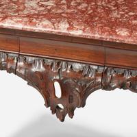 A George II carved walnut side table with breccia marble top circa 1750