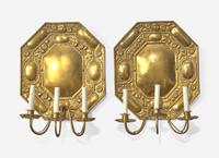 A Pair of Continental Repoussé Decorated Brass Three-Light Sconces