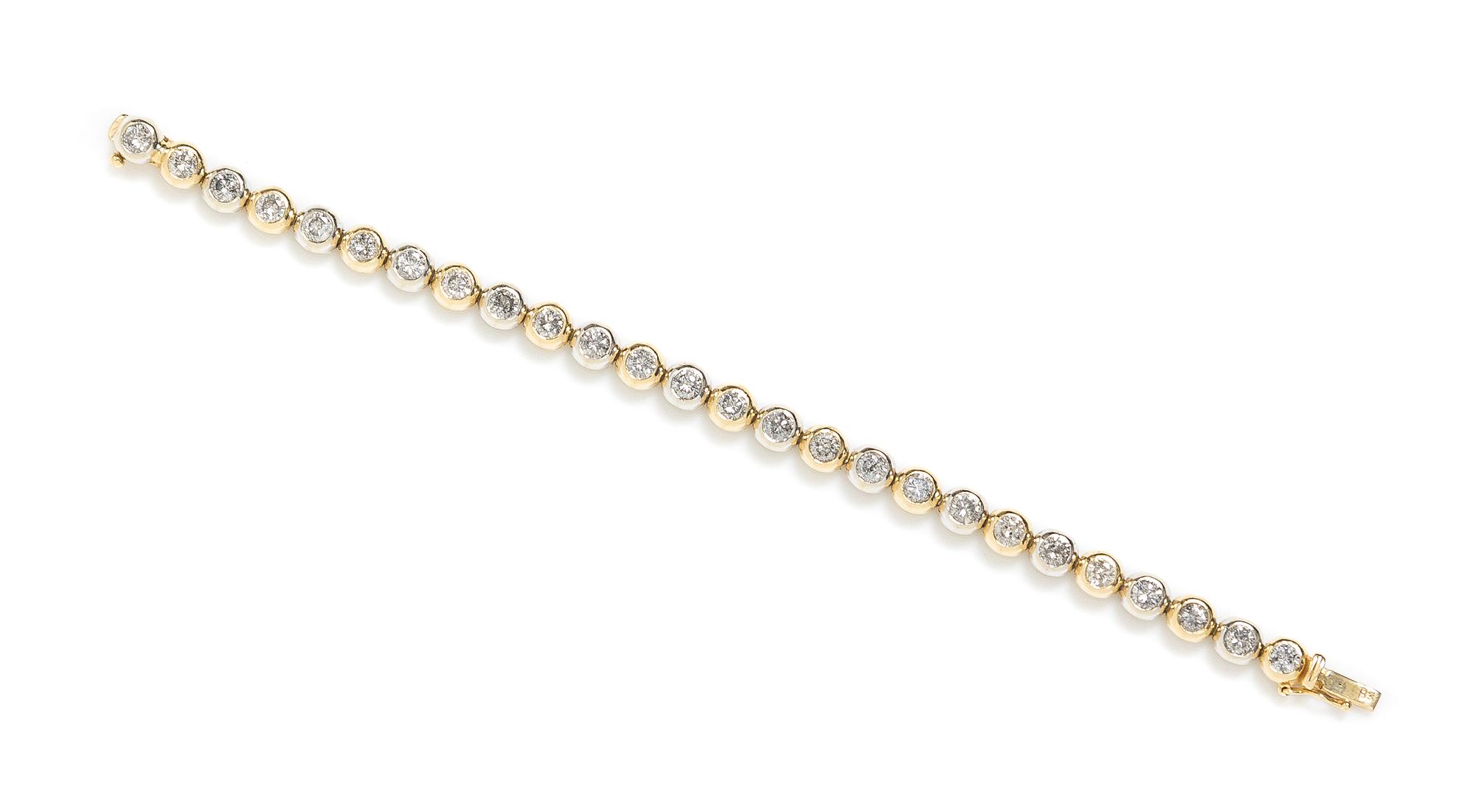 A 14 Karat Gold and Diamond Line Bracelet, 14.90 dwts.