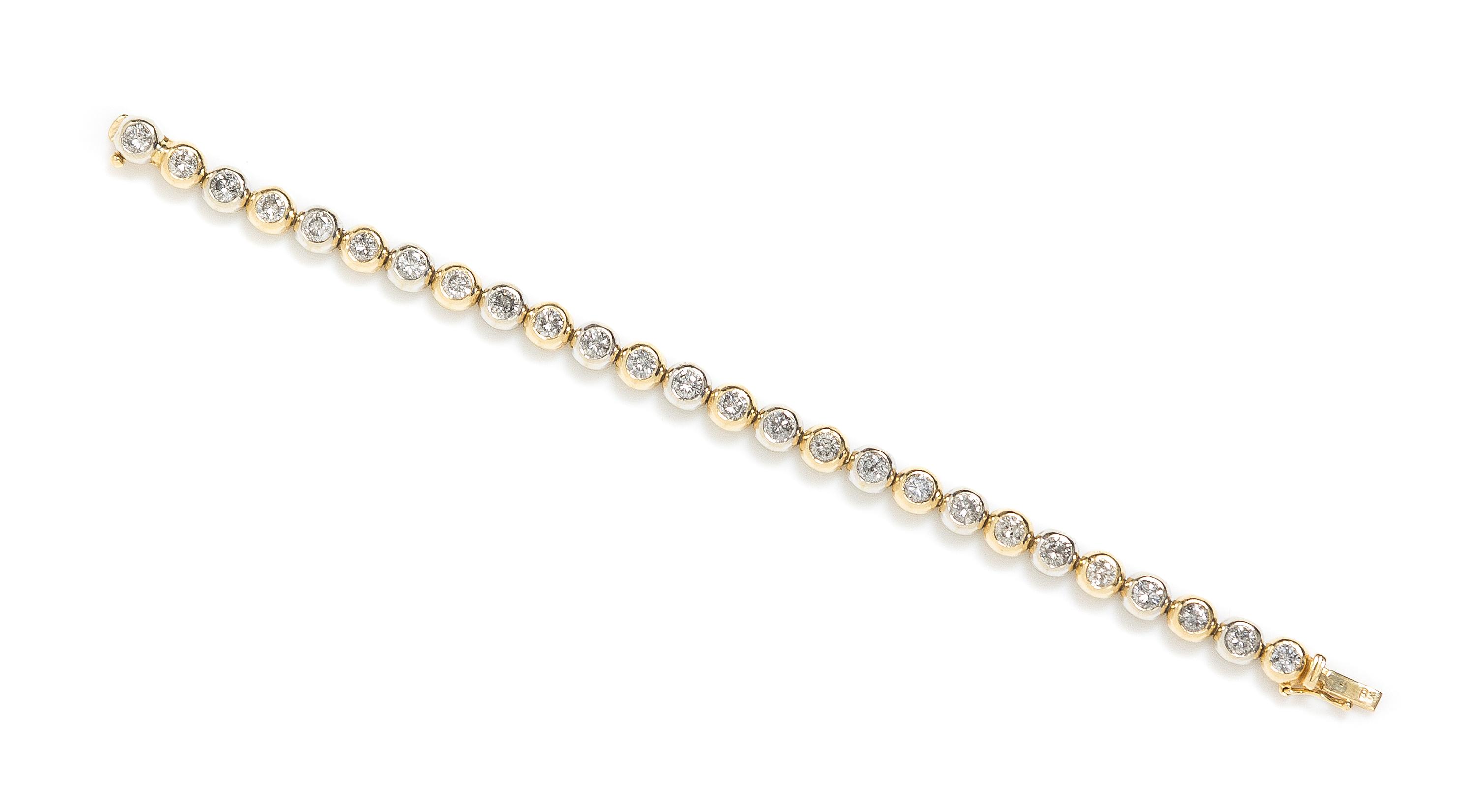 A 14 Karat Gold and Diamond Line Bracelet, 14.90 dwts.