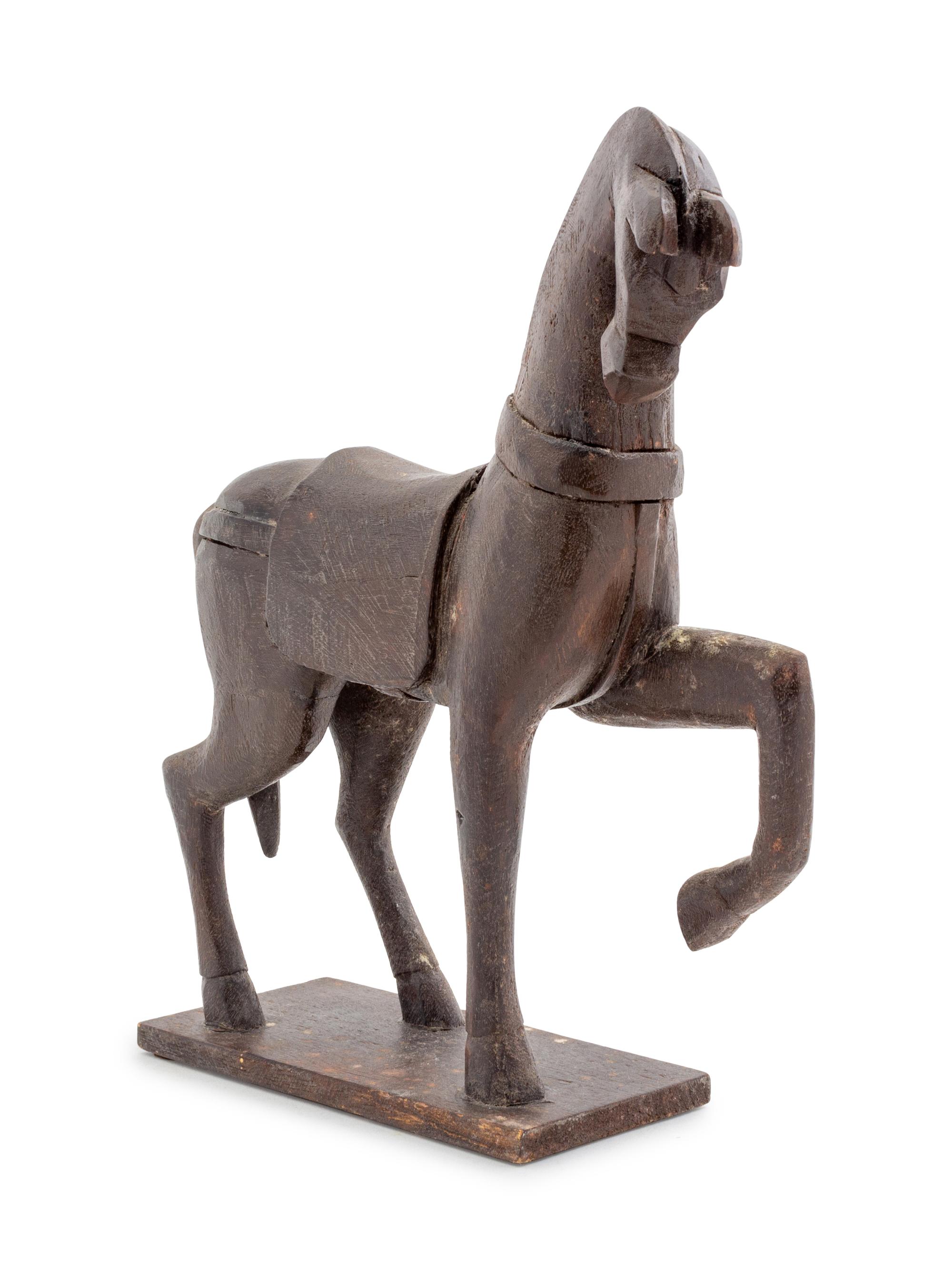 A Carved Wood Model of a Striding Horse