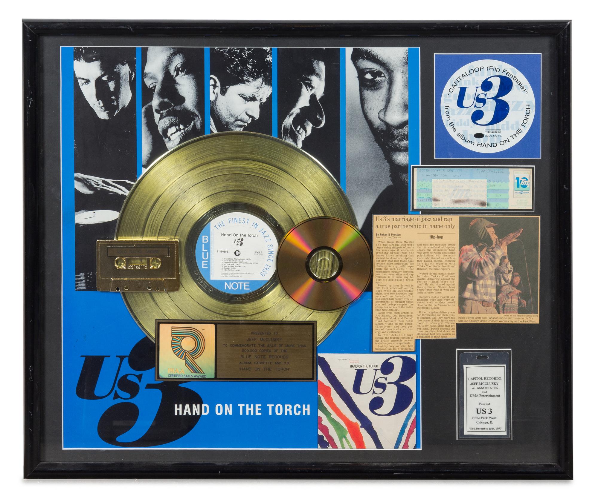 An Us 3: Hand on the Torch RIAA Certified Gold Persentation Album 22 x 26 inches.
