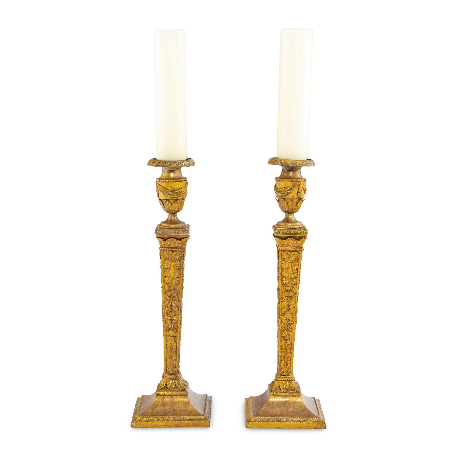 A Pair of Continental Gilt Iron Candlesticks