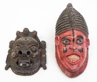 A Collection of Seven Masks Height of largest 17 inches.